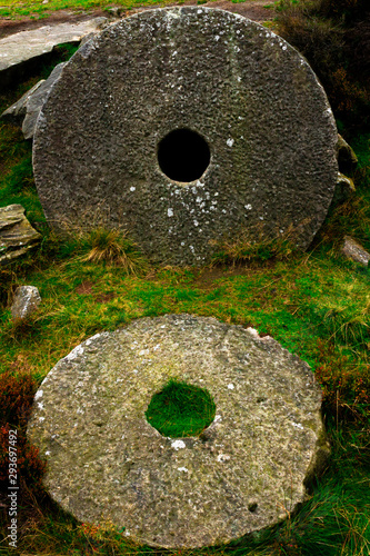 2 Circle Stones With Holes In The Middle photo