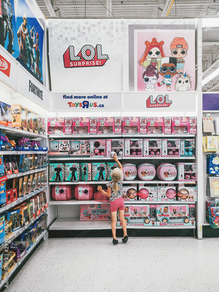 Toronto, Ontario, Canada - July 30, 2019: Cute adorable preschool blonde  Caucasian girl choosing one LOL doll in children store retailer Toys Are  Us. Happy childhood lifestyle. Kid buying toy. Stock Photo | Adobe Stock