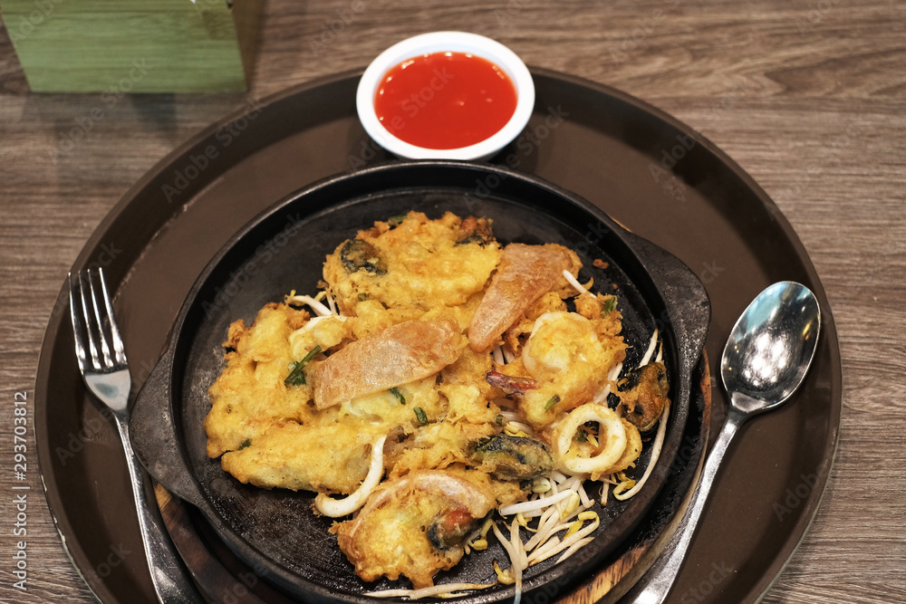 Fried seafood on a hot iron plate Fried seafood on a hot iron plate