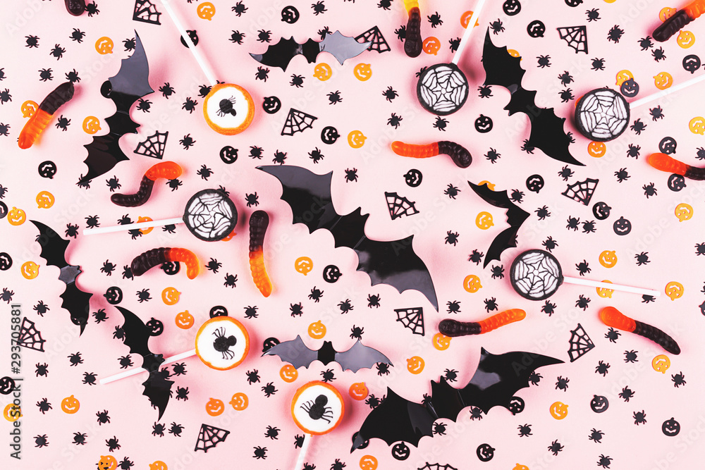Halloween background. Pattern made with confetti, sweets and bats stickers. Halloween background. Pattern made with confetti, sweets and bats stickers.