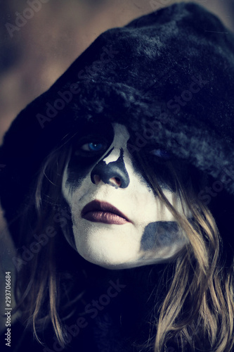 Fototapeta Naklejka Na Ścianę i Meble -  Skull Face Paint On Cloaked Female