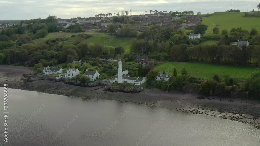 An aerial view of the Tayport West Lighthouse on a cloudy day. Circling right to left from the estuary side of the lighthouse, close view. An aerial view of the Tayport West Lighthouse on a cloudy day. Circling right to left from the estuary side of the lighthouse, close view.