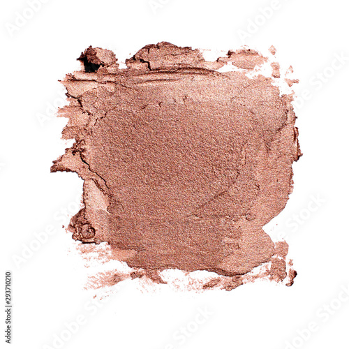 Smear of gold matte metallic lipstick or creamy eye shadow texture on white background luxury cosmetic concept photo