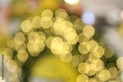 Blurred image of decorative bulbs light during festival such as Christmas and New Year. Beautiful bokeh for wallpaper of background. Defocus and out of focus. photo