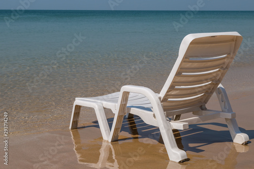 Beach chair at sunny coast at the beach