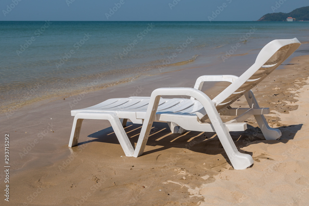 Beach chair at sunny coast at the beach Beach chair at sunny coast at the beach