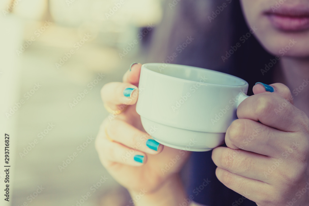 Woman drinking coffee in hand Woman drinking coffee in hand
