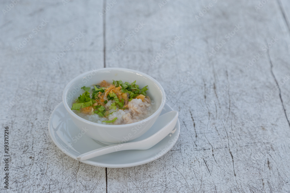 Boiled rice with pork in white bowl Boiled rice with pork in white bowl