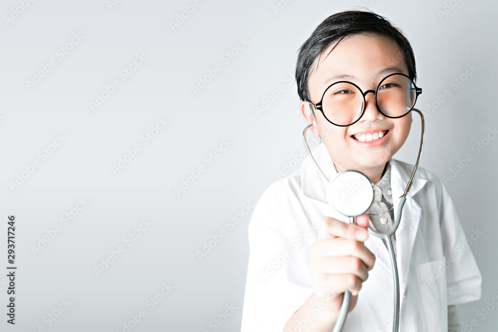 Little boy and stethoscope in doctor uniform with copy space. Little boy and stethoscope in doctor uniform with copy space.