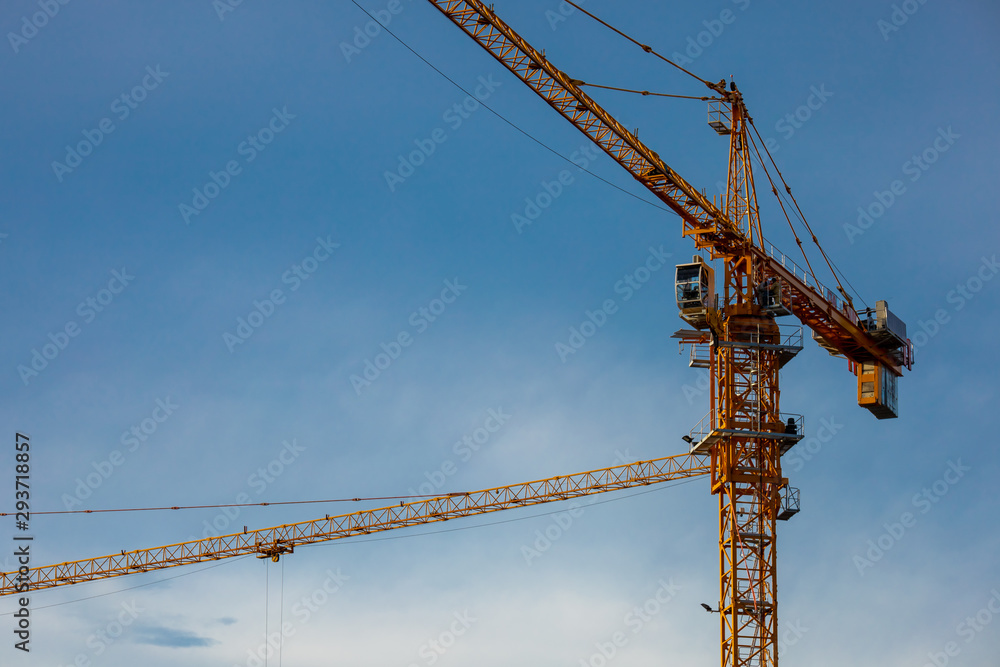 cranes working on a building construction site