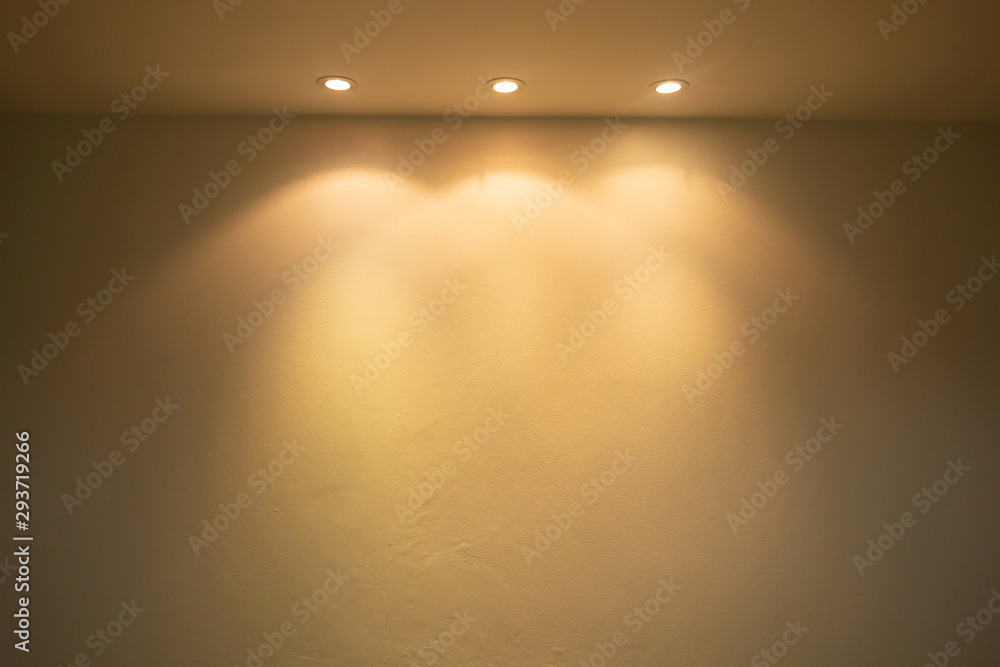 ceiling projector warm lights on wall . - obrazy, fototapety, plakaty 