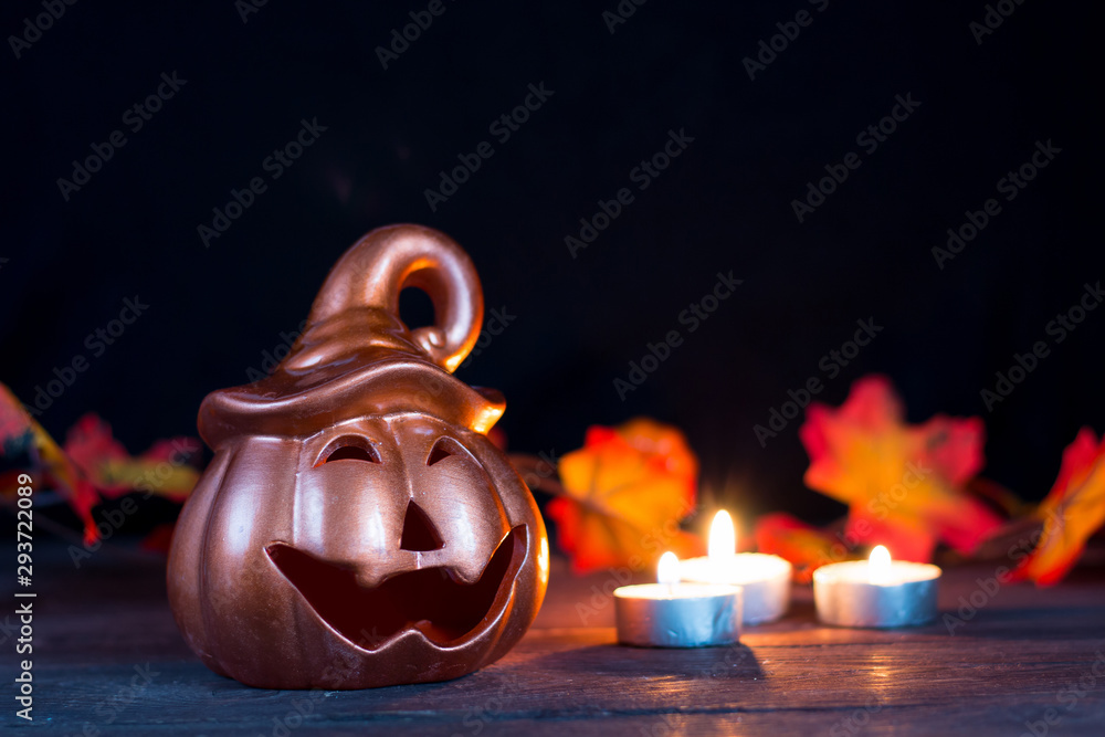 Halloween holiday. Halloween greeting card. Pumpkin with a happy face. Holiday decorations. Place for your text. Halloween holiday. Halloween greeting card. Pumpkin with a happy face. Holiday decorations. Place for your text.