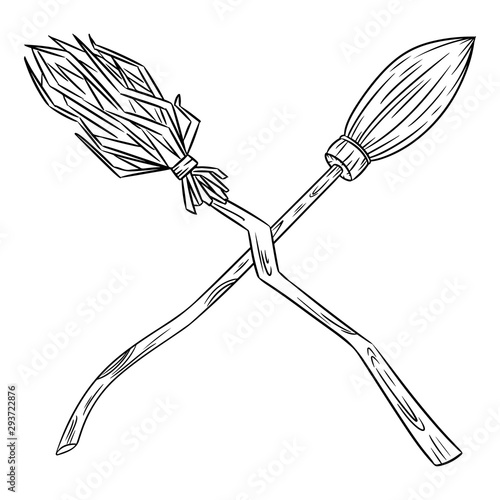 Two crossed broomsticks. Happy Halloween related image with magic brooms