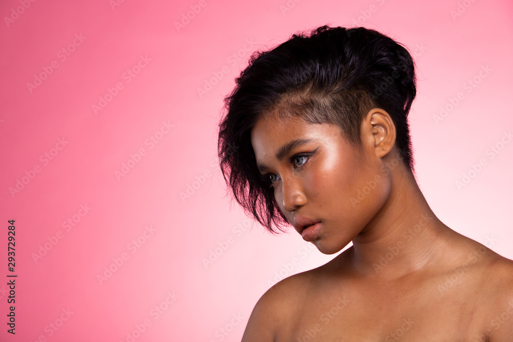 Fashion Model looks at camera for shooting new collection Sunglasses. Beautiful Asian Woman summer trend make up wear Kaleidoscope Glasses with colorful, studio lighting pink background Fashion Model looks at camera for shooting new collection Sunglasses. Beautiful Asian Woman summer trend make up wear Kaleidoscope Glasses with colorful, studio lighting pink background