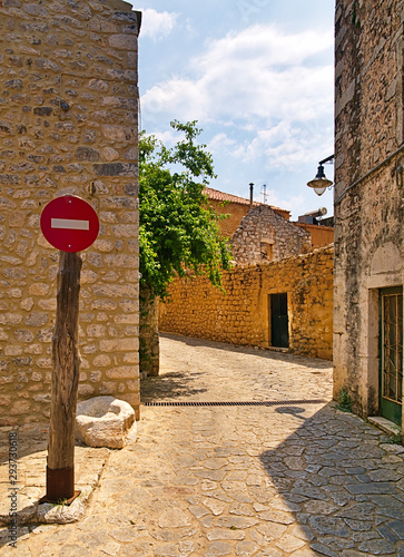 Wallpaper Mural No entrance sign on wooden post in a traditional stone houses village in Mani, Greece. Torontodigital.ca