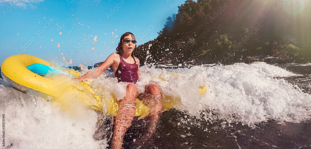 Girl getting splashed by the big waves