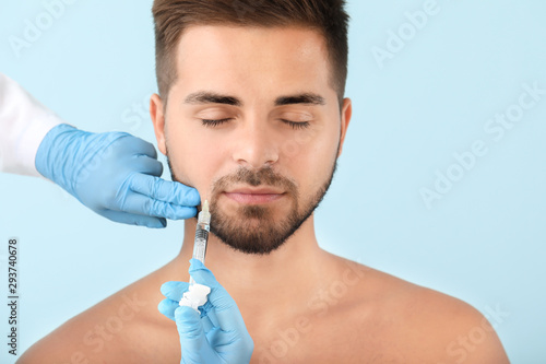 Handsome man receiving fill...