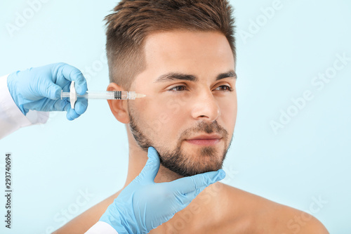 Handsome man receiving fill...