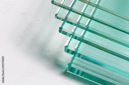 Clear glass from factories of various sizes arranged in multiple sheets photo