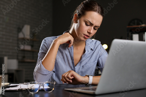 Tired businesswoman trying ...