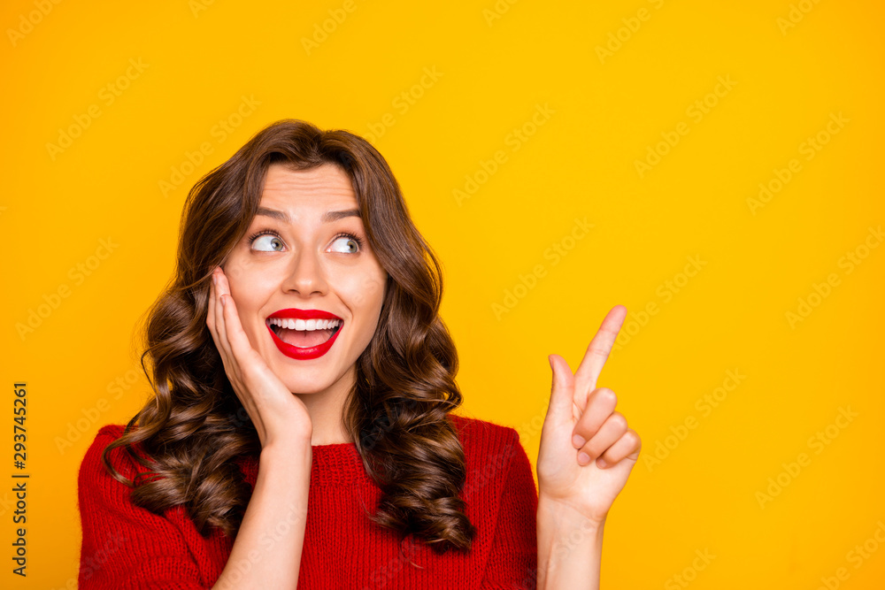Photo of curly wavy white trendy charming cute pretty sweet girlfriend wearing red sweater pointing up astonished isolated with yellow vivid color background Photo of curly wavy white trendy charming cute pretty sweet girlfriend wearing red sweater pointing up astonished isolated with yellow vivid color background