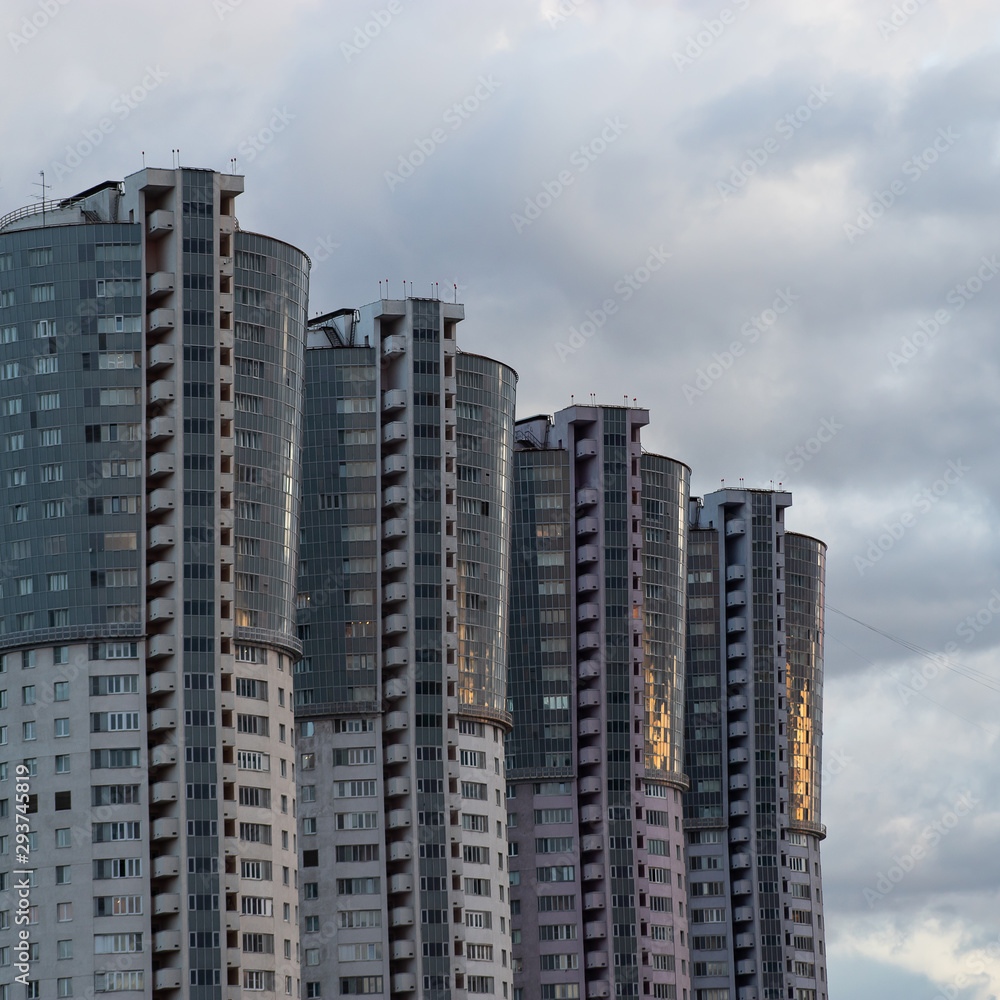 High-rise modern buildings. New apartment buildings against a cloudy sky. Urban landscape.