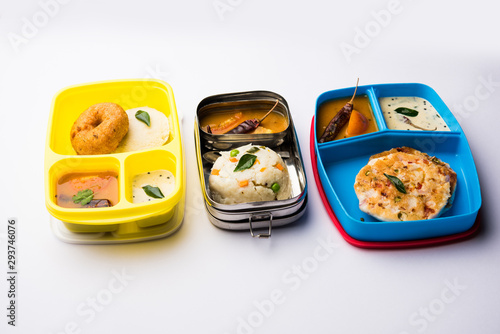 Assorted South Indian tiffin / lunch box food in group, includes idli vada, uttapam/uthappam, upma with sambar and chutney photo