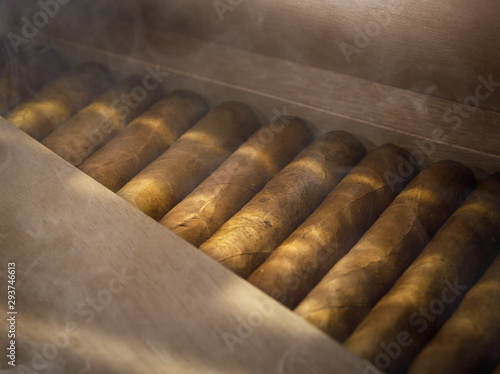 фотографія close up view of box of  cuban hand made cigars in wooden humidor