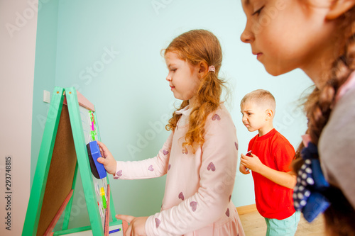Children play and learn with magnetic board. Back to school. photo