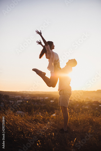 Young man toss up his woman to the sky they send Genuine emotions  to the world.