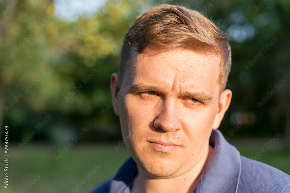 Person offended men. Portrait of a young guy on nature background, feelings and people reaction. Person offended men. Portrait of a young guy on nature background, feelings and people reaction.