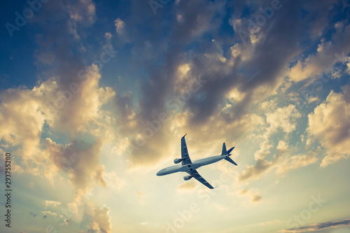 Airplane on blue sky and clouds, fly concept