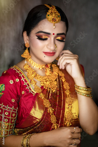 Young indian Bride in traditional sari and jewelry. South Indian and Maharashtran bride look. 