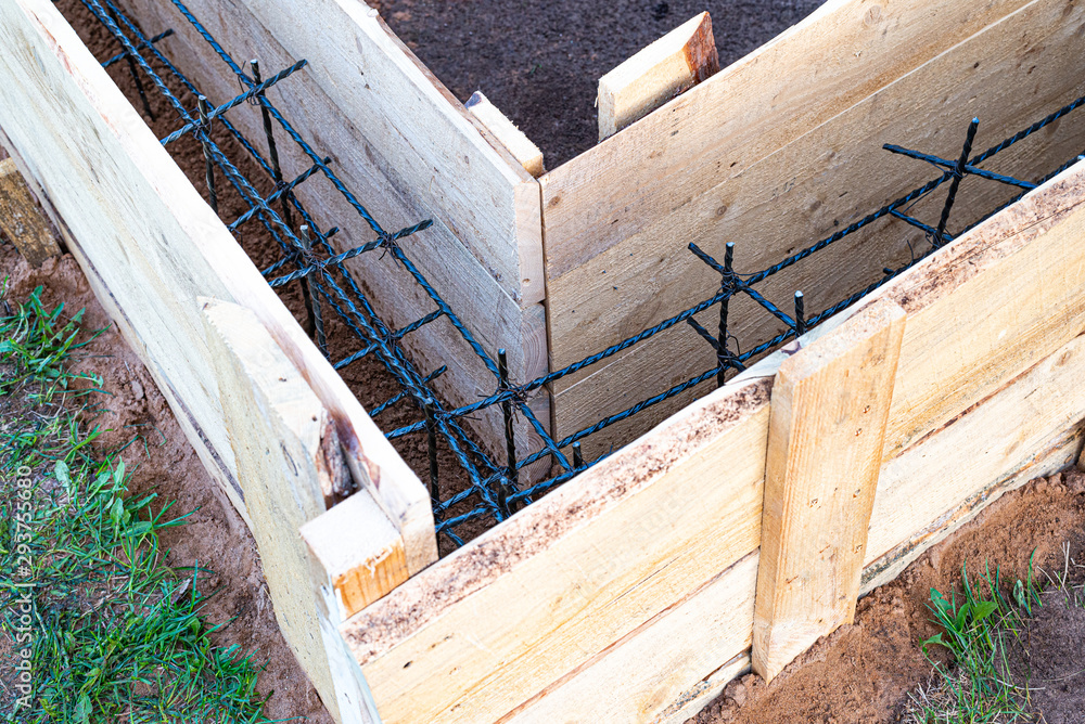 Wooden formwork with carbon fiber reinforcement inside, ready for concreting the Foundation of the village buildings. Wooden formwork with carbon fiber reinforcement inside, ready for concreting the Foundation of the village buildings.