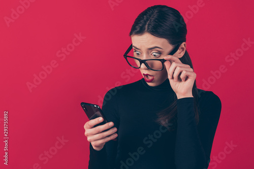 Close-up portrait of her she nice-looking attractive pretty impressed shocked girl using cell online shopping incredible outlet isolated on maroon burgundy marsala red pastel color background