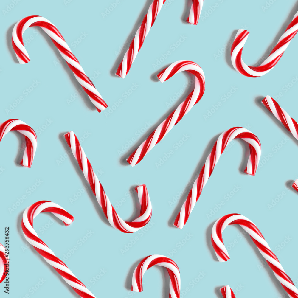 Christmas candies lie on blue background. Flat lay and top view Christmas candies lie on blue background. Flat lay and top view