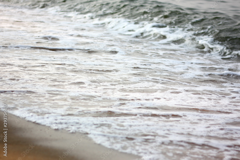 sea wave go on cost .wind over the sea make wave and bubble go on sand beach ,copy space sea wave go on cost .wind over the sea make wave and bubble go on sand beach ,copy space