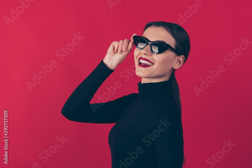 Close-up profile side view portrait of her she nice-looking attractive lovely cheerful cheery girl touching specs accessory sale isolated over maroon burgundy marsala red pastel color background