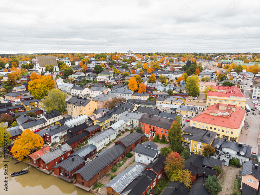 Porvoo, Finland - 2 October 2019: Aerial autumn view of Old town of Porvoo, Finland. Beautiful city landscape with idyllic river Porvoonjoki, old colorful wooden buildings and Porvoo Cathedral.