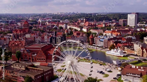 Aerial shot of feris wheel and old town in Gdańsk city in Poland. photo