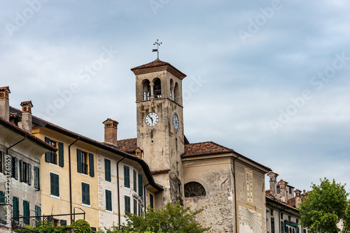 Medieval church of San Giacomo (St James) with the ancient bell tower and sundial. Feltre, Belluno province, Veneto, Italy, south Europe