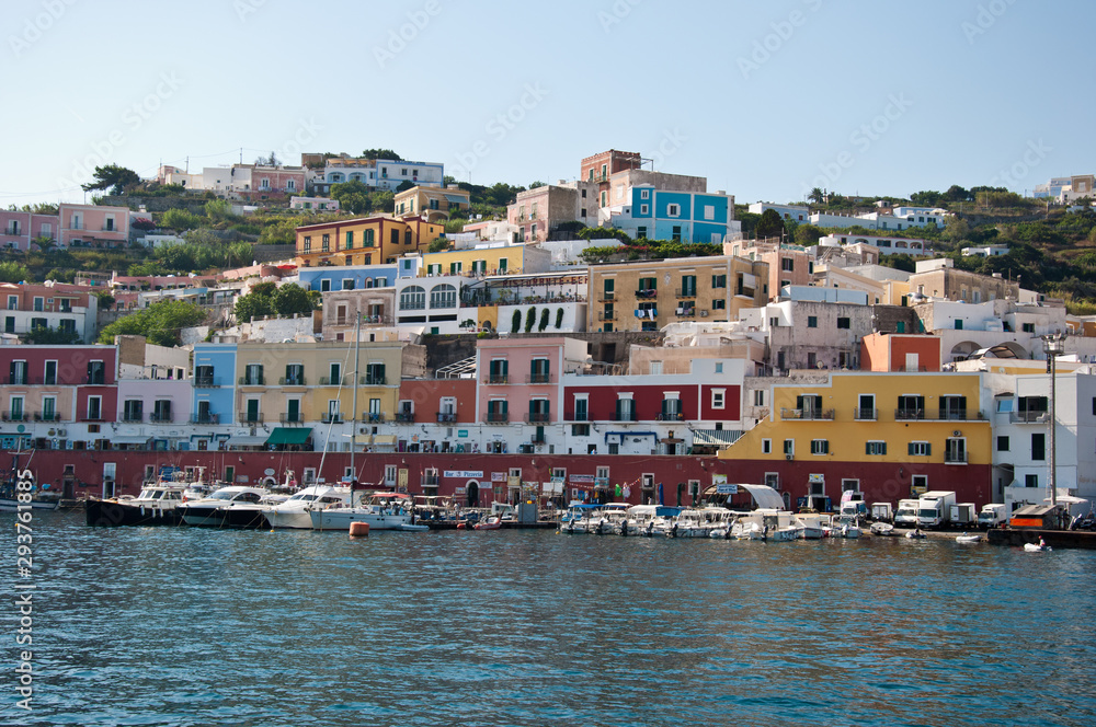 Ponza, Lazio / Italy - August 9 2019: port of the island of Ponza in the summer. The typical colored houses of the island of Ponza. Landscape of the harbor of island of Ponza.