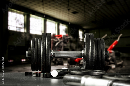 Gym interior and dumbbells on black desk with free space for your decoration.  © magdal3na