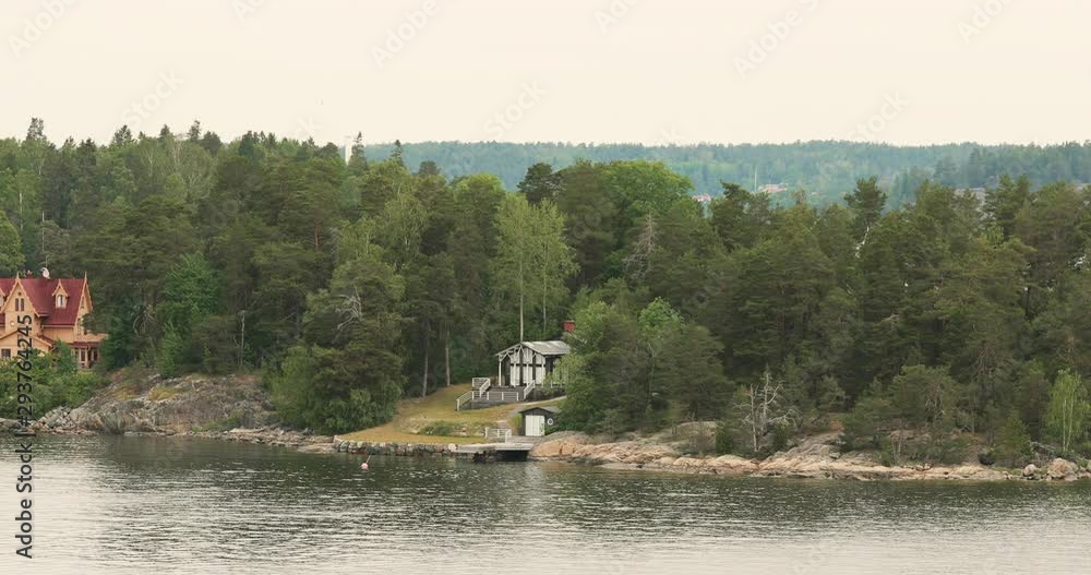 Swedish Wooden Sauna Log Cabin House On Island Coast In Summer Cloudy Day Swedish Wooden Sauna Log Cabin House On Island Coast In Summer Cloudy Day