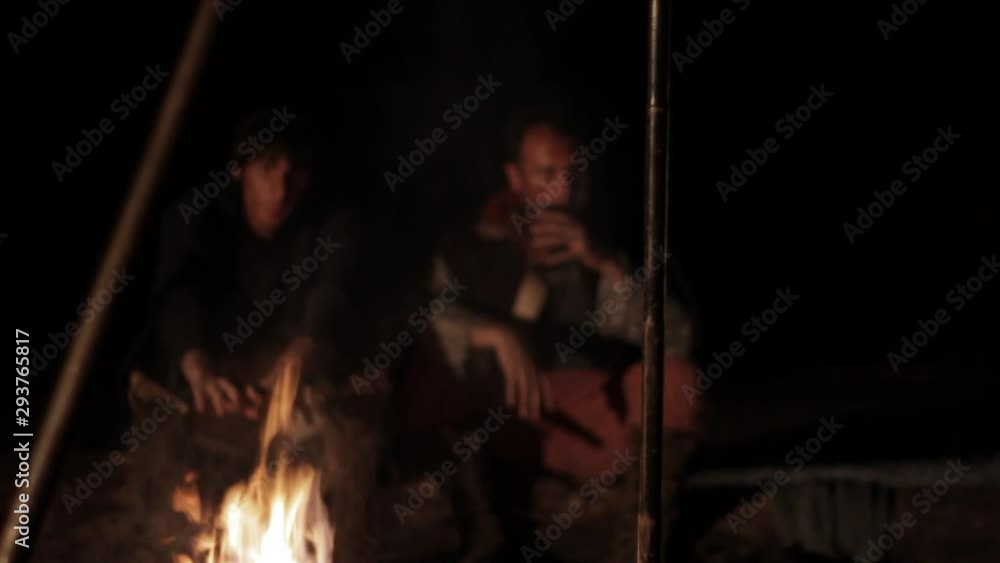 Two medieval knights falls asleep near a campfire Two medieval knights falls asleep near a campfire