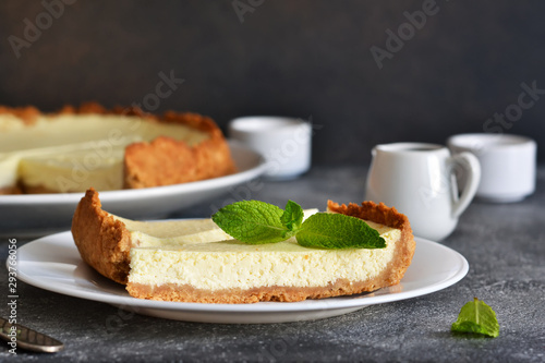 Cheesecake slice on a white plate. Close-up