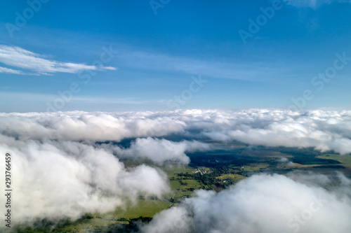 Beautiful views of the countryside from a great height. Flying above the clouds.