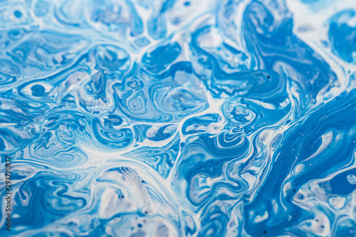 Fotografija Blue and white paint mixture background