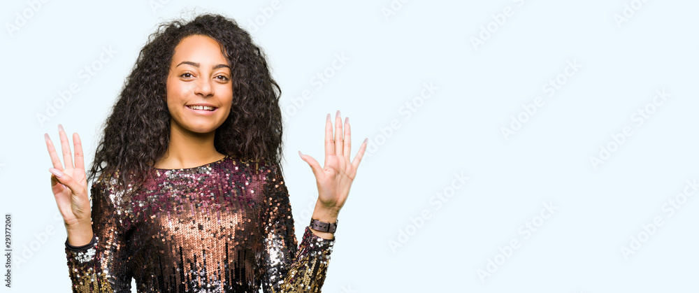 Young beautiful girl with curly hair wearing night party dress showing and pointing up with fingers number eight while smiling confident and happy.