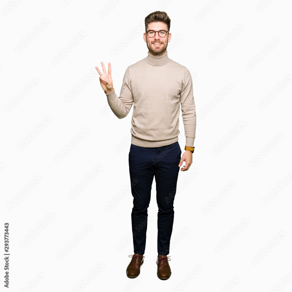 Young handsome business man wearing glasses showing and pointing up with fingers number three while smiling confident and happy. Young handsome business man wearing glasses showing and pointing up with fingers number three while smiling confident and happy.